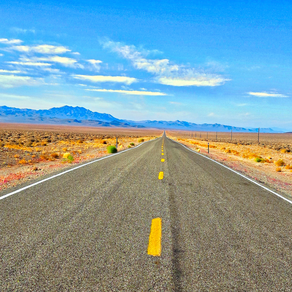 Open road stretched through the desert
